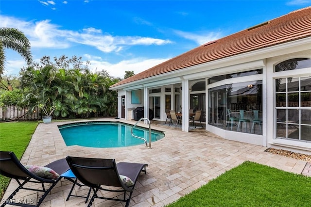 view of swimming pool featuring a patio area