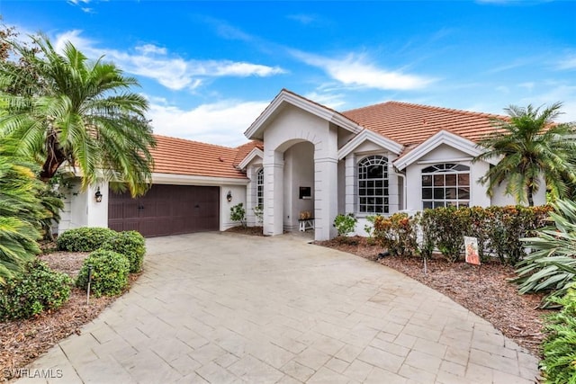 single story home with a garage