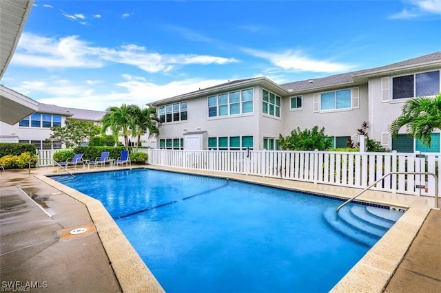 view of swimming pool with a patio