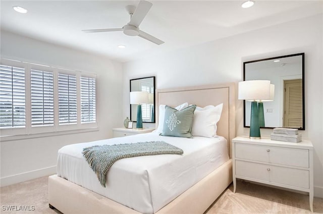 carpeted bedroom featuring ceiling fan