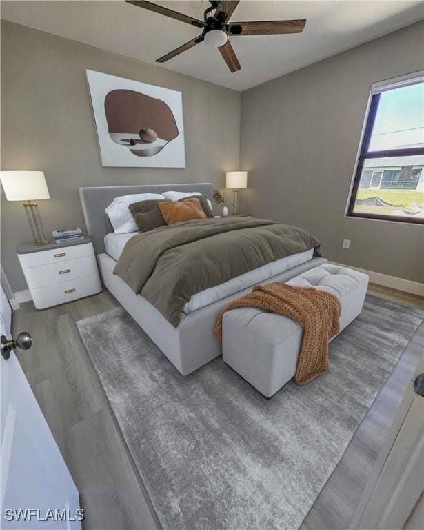 bedroom featuring light hardwood / wood-style floors and ceiling fan