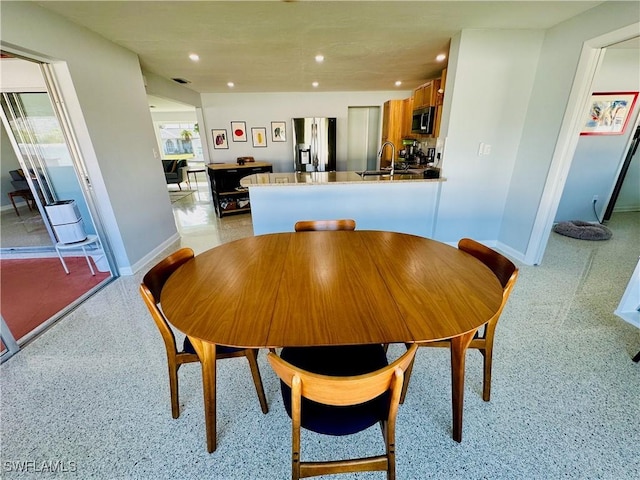 dining space with pool table and sink