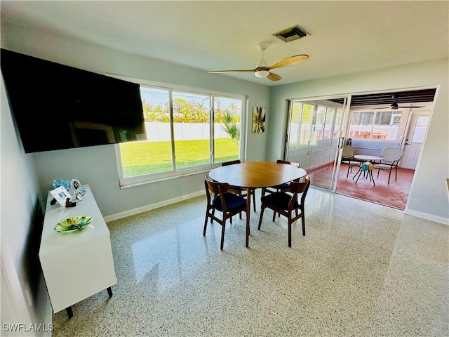 dining area with a wealth of natural light and ceiling fan