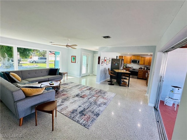 living room featuring ceiling fan