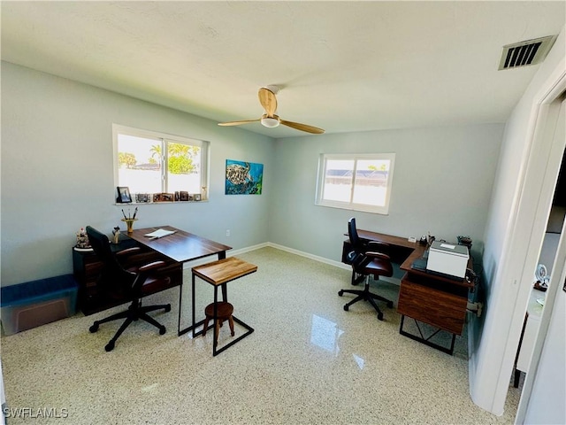 office area featuring a wealth of natural light and ceiling fan