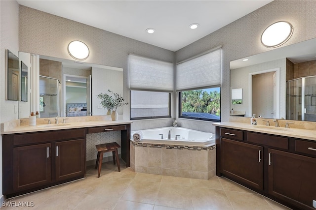 bathroom featuring vanity, tile patterned floors, and shower with separate bathtub