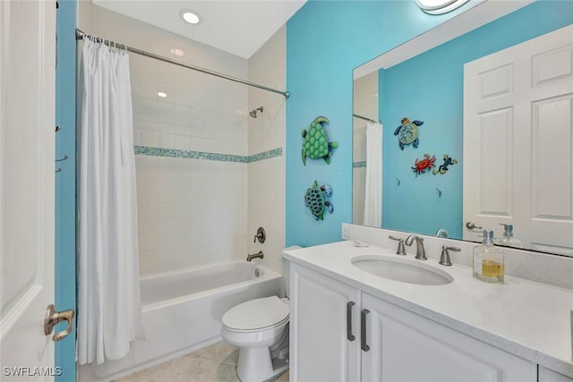 full bathroom with tile patterned floors, vanity, toilet, and shower / bath combo with shower curtain