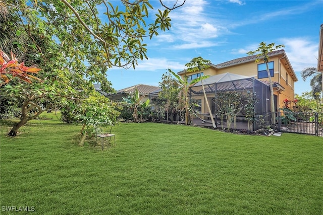 view of yard with a lanai