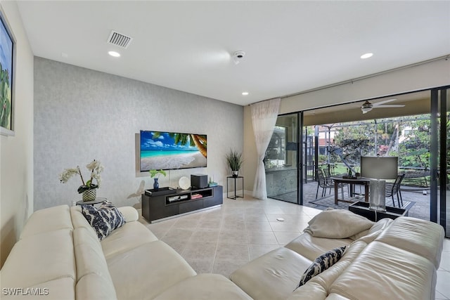 living room with light tile patterned flooring and ceiling fan