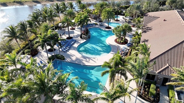 birds eye view of property with a water view