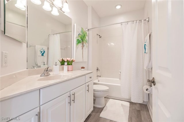 full bathroom featuring vanity, wood-type flooring, shower / bath combo, and toilet