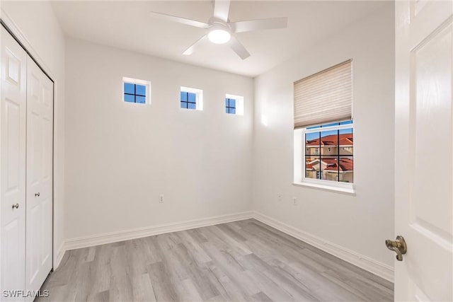 interior space featuring ceiling fan, a closet, and light hardwood / wood-style floors