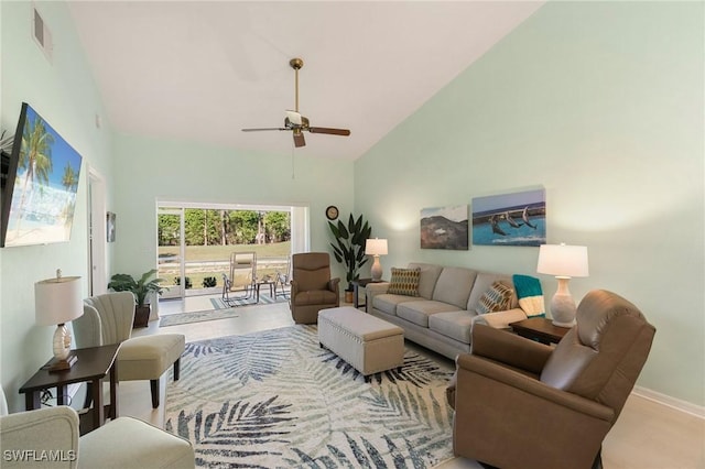 living room with ceiling fan and vaulted ceiling