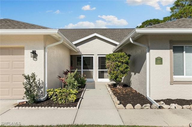 entrance to property featuring a garage