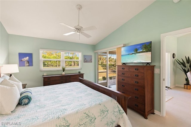 bedroom with access to exterior, multiple windows, ceiling fan, and lofted ceiling