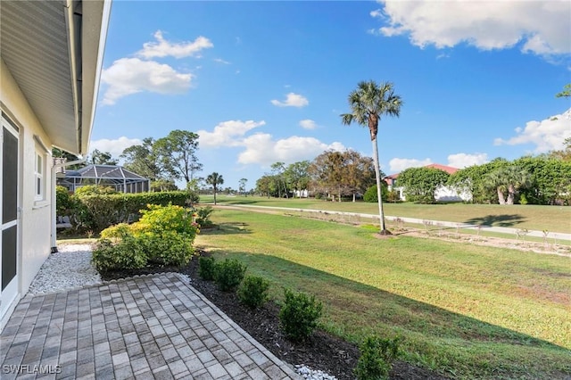 view of yard featuring glass enclosure