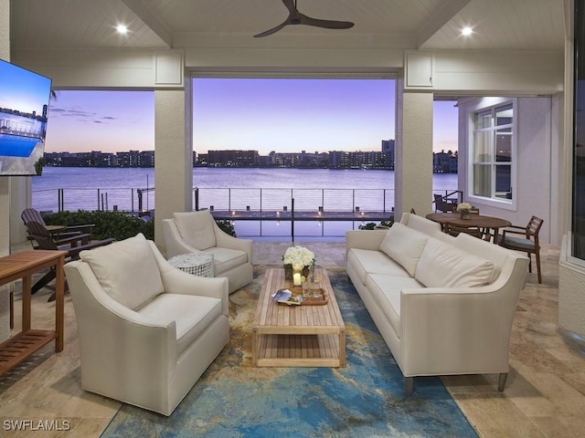 view of patio / terrace with ceiling fan and an outdoor living space