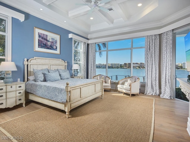 bedroom featuring coffered ceiling, a water view, ceiling fan, beam ceiling, and light hardwood / wood-style floors