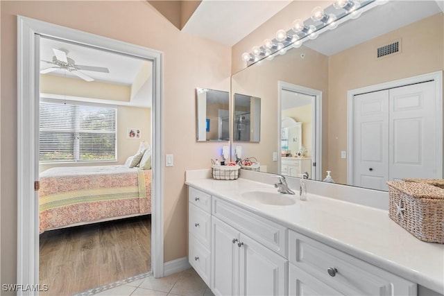 bathroom with tile patterned floors, ceiling fan, and vanity