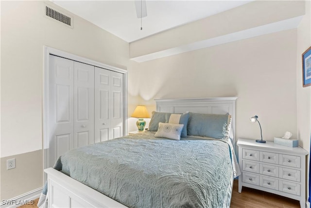 bedroom featuring hardwood / wood-style flooring, a closet, and ceiling fan