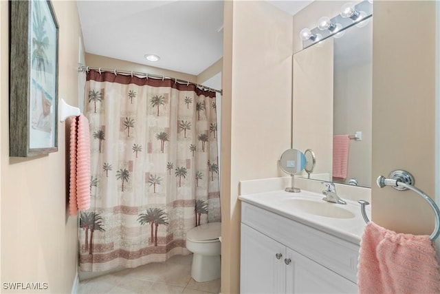 bathroom featuring toilet, vanity, tile patterned floors, and a shower with shower curtain