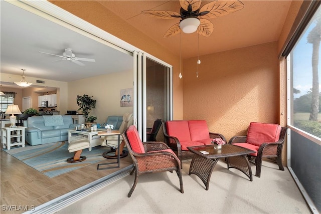 sunroom / solarium with ceiling fan