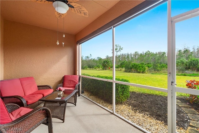 sunroom / solarium with ceiling fan