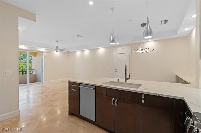 kitchen featuring dark brown cabinetry, ceiling fan, sink, light stone counters, and pendant lighting