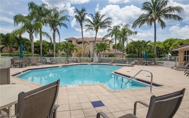 view of pool featuring a patio