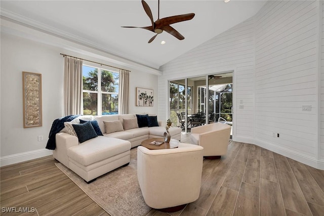 living room featuring hardwood / wood-style flooring and high vaulted ceiling