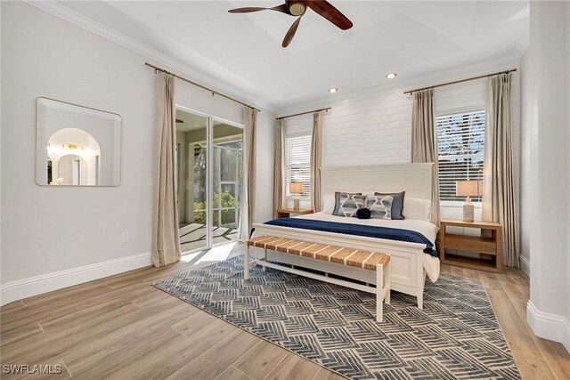 bedroom with hardwood / wood-style flooring, ceiling fan, access to exterior, and ornamental molding