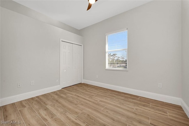 unfurnished bedroom with a closet, ceiling fan, and light hardwood / wood-style flooring