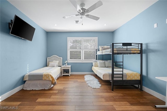 bedroom with ceiling fan and hardwood / wood-style floors