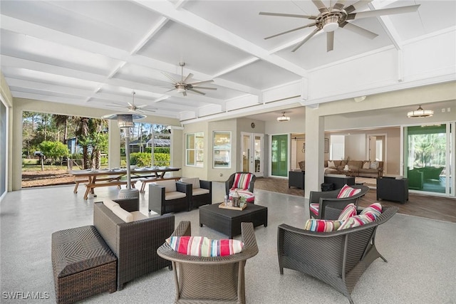 interior space with beamed ceiling, a wealth of natural light, and coffered ceiling