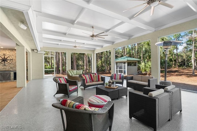 interior space with ceiling fan and an outdoor hangout area