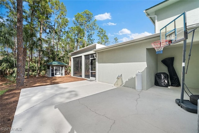 view of patio featuring a shed