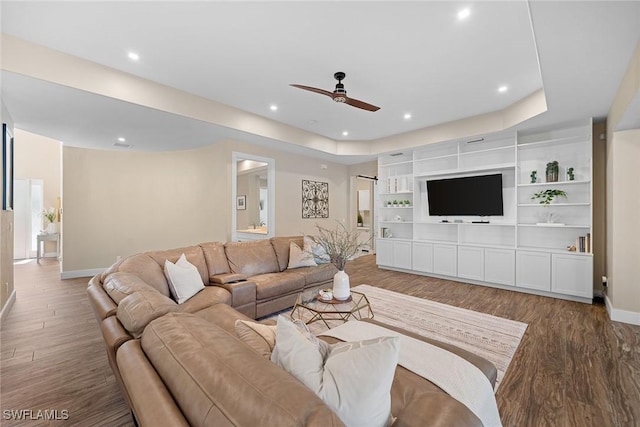 living room featuring ceiling fan and hardwood / wood-style floors