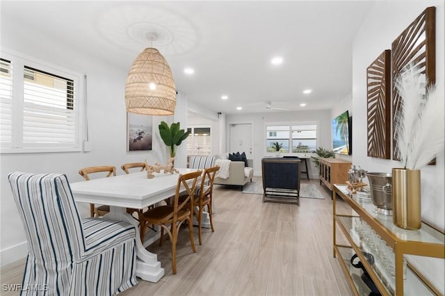 dining space featuring light wood-type flooring