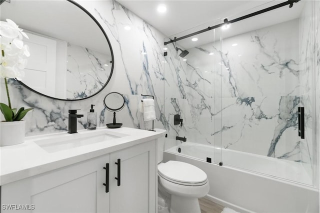 full bathroom featuring hardwood / wood-style floors, vanity, enclosed tub / shower combo, and toilet