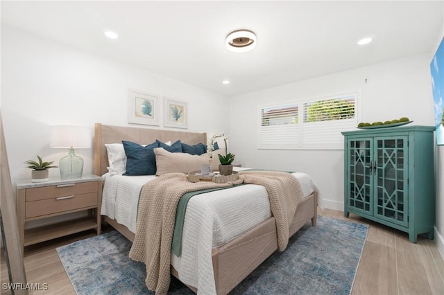 bedroom featuring light wood-type flooring