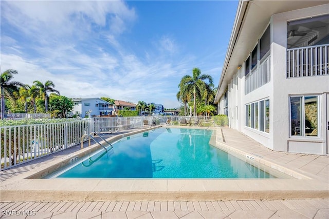 view of swimming pool with a patio