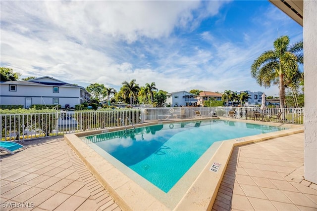 view of swimming pool with a patio area