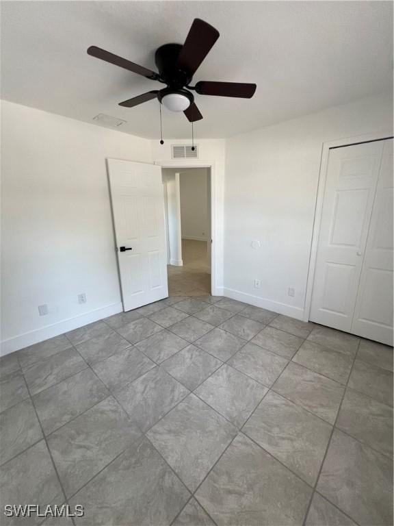 unfurnished room with ceiling fan