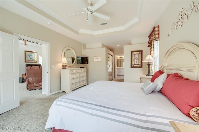 carpeted bedroom with a raised ceiling, ceiling fan, and ornamental molding