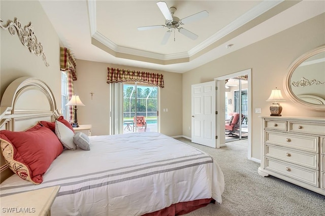 bedroom with a raised ceiling, crown molding, ceiling fan, access to exterior, and light colored carpet