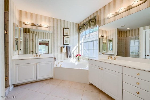 bathroom with tile patterned flooring, vanity, and independent shower and bath