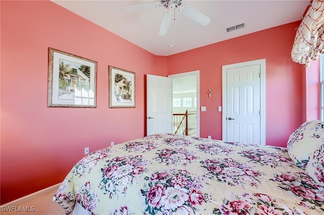 carpeted bedroom with ceiling fan