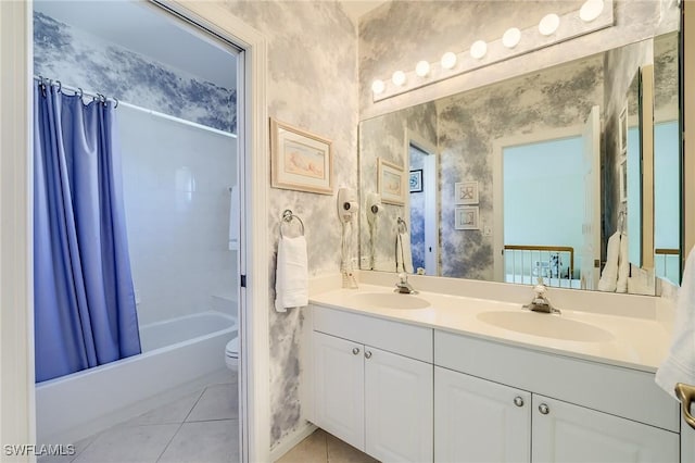 full bathroom with tile patterned floors, shower / bath combo, toilet, and vanity