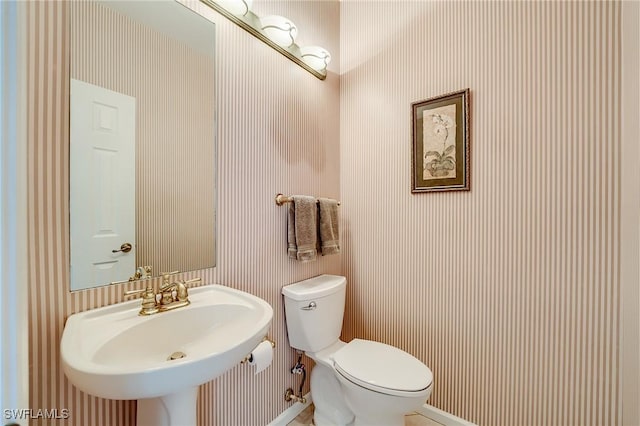 bathroom with toilet and sink