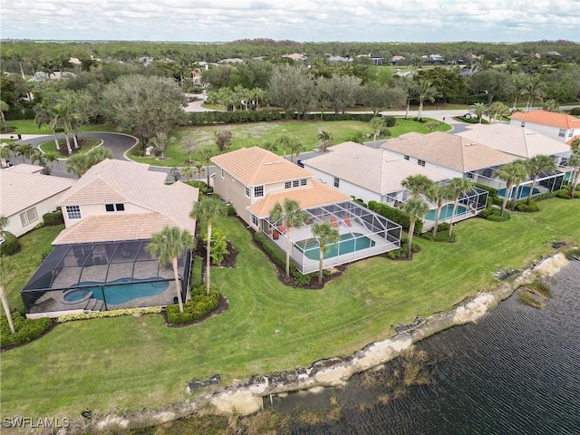 birds eye view of property with a water view